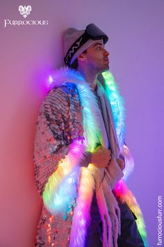 USA-made LED Men's Kimono Coat. This luxury, festival essential not only keeps you warm and cozy but transforms you into a walking canvas of 200 changeable LED patterns. Featuring 5 functional pockets and backpack straps to morph it into a cape when things heat up. Made from super soft material, this Burning-Man-friendly outfit sets you apart, turning heads from dusk till dawn.  SHOP NOW @ furrociousfurr.com. Invest in Men's festival fashion that does more than just impress. Mens Festival Fashion, Men's Kimono, From Dusk Till Dawn, Sequin Kimono, Queen Of The Night, Chinchilla Fur, King Or Queen, Open Sleeves, Kimono Coat