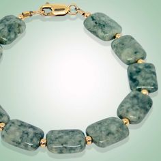 Crafted with a combination of rectangle shaped flat beads and gold-filled, this bracelet will make heads turn. Designed to make a statement, the Rania Bracelet will give you an effortless and classic look. Leaf green jade (13x10mm) Gold-filled beads and clasp Length: 7.5" Elegant Rectangular Gemstone Beads Jewelry, Green Rectangular Gemstone Beads Jewelry, Rectangular Gemstone Beads Gold Jewelry, Gold Rectangular Jewelry With Gemstone Beads, Gold Rectangular Gemstone Beads Jewelry, Rectangular Gold Jewelry With Gemstone Beads, Elegant Green Rectangular Bracelet, Green Rectangular Bracelet For Formal Occasions, Green Rectangular Bracelets For Formal Occasions