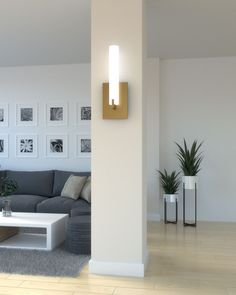 a living room filled with furniture and pictures on the wall