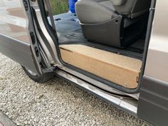 an open car door with the seat up