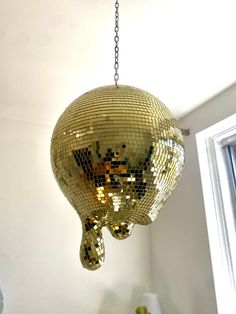 a mirror ball hanging from the ceiling in a room