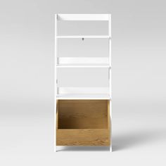 a white book shelf with two shelves on each side and an open drawer in the middle