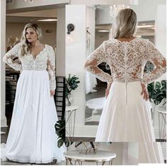 a woman wearing a long sleeved wedding dress in front of a mirror with her hands on her hips