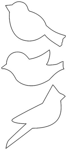 three birds that are cut out from paper