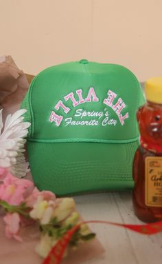 Spring's favorite city: Fayetteville, AR! The Farmer's Market, baseball games at Baum Walker, tulips blossoming on The Square! It's the best time of the year! This green trucker hat features a trendy pink embroidered graphic - perfect for everyone who loves "The Ville." ALL HATS ARE FINAL SALE! Spring Trucker Hat, One Size Fits Most, Green Spring Trucker Hat, Green Trucker Hat For Spring, One Size Fits Most, Retro Curved Bill Hats For Spring, Retro Snapback Hat With Curved Bill For Spring, Spring Trucker Cap, Trendy Green Trucker Hat For Spring, Trucker Snapback Hat With Letter Print For Spring, Green Adjustable Trucker Hat For Spring