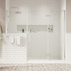 a white tiled bathroom with a walk in shower