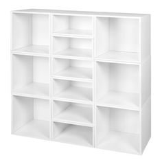 a white bookcase with six sections on each side and four shelves in the middle