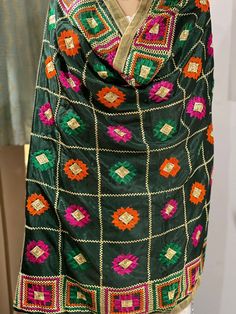 Product details:- Dark green phulkari embroidered Dupatta and has taping border.  Size :-  Length:-2.12 meters Width:-37 inches Material:- Polly chinon. Hand wash . Phulkari Dupatta, Embroidered Dupatta, Oct 31, Hand Embroidery Patterns, Green Pattern, Embroidery Patterns, Hand Embroidery, Dark Green, Scarf Accessory