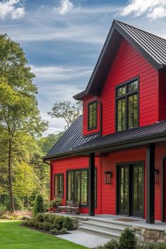 a red house with black trim and windows