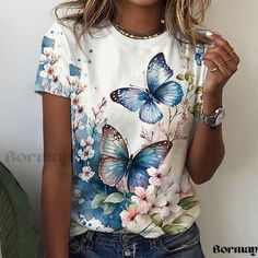 Lightweight Short Sleeve T-Shirts with Vibrant Floral Patterns Butterfly Print Short Sleeve Tops For Spring, Short Sleeve Tops With Butterfly Print For Spring, Cotton Tops With Butterfly Print And Short Sleeves, White Butterfly Print Tops For Summer, White Butterfly Print Top For Summer, Casual Green Top With Butterfly Print, Short Sleeve Cotton Tops With Butterfly Print, White Casual Top With Butterfly Print, Blue Top With Butterfly Print And Crew Neck