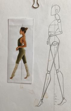 a drawing of a woman in tights and leggings next to a paper cut out of a human figure