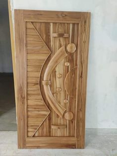 a wooden door with an intricate design on it