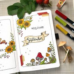 an open notebook with flowers and plants on it