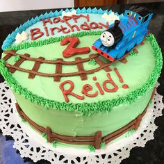 a thomas the train birthday cake on a table