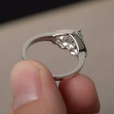 This is a gorgeous handmade creation. Its beauty is its simplicity & Elegance. The 6*6 mm heart cut faceted natural Aquamarine is crafted in solid sterling silver and with rhodium plated. All item is sent in a beautiful gift box If you have any idea of design your ring,pls contact me directly. You can realize more lovely stuff clicking the link https://www.etsy.com/shop/knightjewelry?refshopsection_shophome_leftnav Please leave the correct address and you phone number for delivering successf Oval Heart Ring With Center Stone For Promise, Elegant Moissanite Heart Ring, Elegant Round Moissanite Heart Ring, Moissanite Heart Ring With Round Cut For Gifting, Blue Topaz Heart Cut Promise Ring, Sterling Silver Heart Cut Topaz Promise Ring, Sterling Silver Crystal Ring With Bezel Setting For Promise, Heart Cut Brilliant Birthstone Promise Ring, Sterling Silver Trillion Cut Center Stone Jewelry