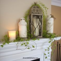 some candles are sitting on top of a mantle