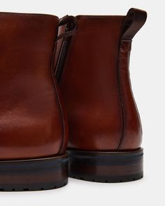 1.25 inch heel height 10.25 inch shaft circumference 5.75 inch shaft height Leather upper material Leather lining Leather sock Rubber sole Imported Steve Madden Store, Ankle Boots Men, Apparel Merchandising, Leather Socks, Men's Boots, Leather And Lace, Tan Leather, Boots Men, Rubber Sole