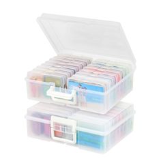 two plastic storage boxes filled with different colored items