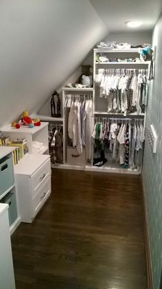 an attic closet with clothes and other items