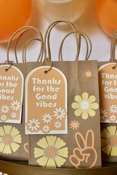 small tags with thank you for the good vibe written on them are attached to brown paper bags