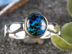 Thank you for visiting 3 Kings Opals. Boulder Opal, 925 Silver and 14ct Gold. The size of the ring is size US  Face dimensions: Length:       08mm  rounded Hi, We Hope you're having a great day!  This ring is part of our new 'gold bezel with silver band' line. The design keeps with our minimalist roots and also just adds a touch of class. The effect you get is mesmerising. The 14ct gold bezel makes the natural solid boulder opals colours pop out and grab you. As well as keeping the price down; t Sterling Silver Opal Ring With Polished Finish, Sterling Silver Yellow Gold Opal Ring, Sterling Silver Opal Ring In Yellow Gold, Yellow Gold Sterling Silver Opal Ring, Polished Opal Promise Ring, Polished Opal Ring For Anniversary, Polished Finish Opal Ring For Anniversary, Sterling Silver Opal Fine Jewelry Ring, Sterling Silver Opal Ring Fine Jewelry