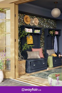 an open door to a living room filled with lots of furniture and hats on the shelves