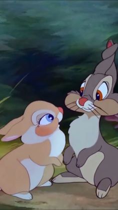 two cartoon rabbits sitting next to each other