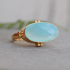 Oval Rose Cut Aqua Chalcedony 925 Sterling Silver ring, Chalcedony Micron Yellow Gold Rose Gold Filled Ring, Artisan Birthstone Ring  Stone size : Approx: 8 x 18 mm stone :  Aqua Chalcedony ring size : Please choose your size metal : Yellow Gold Fill I realize every ring on command. NOTE: We use good quality gemstone. Therefore they might vary a little in color, hue and reflection. But i assure you will like it. We use base material 925 solid silver then gold fillor rose gold on the ring. If you will do care the ring of gold fill it will go last longer. Yellow Gold Amethyst Ring, Aqua Chalcedony Ring, Gold Amethyst Ring, Chalcedony Ring, Copper Rose, Aqua Chalcedony, Gold Filled Ring, Zodiac Jewelry, Birthstone Ring