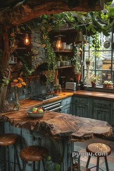 a rustic kitchen with green cabinets and wooden stools, an island made out of tree trunks