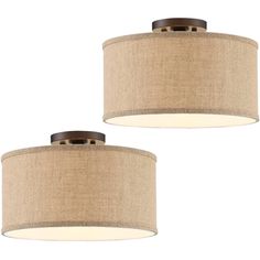 two lamps that are next to each other on a white background, one is brown and the other is beige