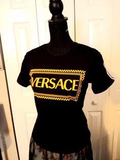 Vintage Italian designer Versace black with gold logo swag crew neck t-shirt with white double stripes on sleeves, Elastane sports blend fabric. Size small womens, made in Italy, 1990s. Perfect unused condition. Italian Designer, Gold Logo, Vintage Italian, Halloween Shopping, Versace, Bathing Beauties, Adult Outfits, Stripes, Womens Sizes