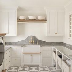 the kitchen is clean and ready to be used as a washer and dryer