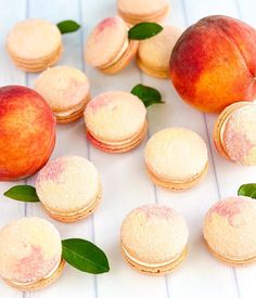 peaches and macaroons are arranged on a table