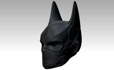 the batman mask is made out of black plastic, and has horns on it's head