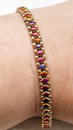 a close up of a person wearing a bracelet