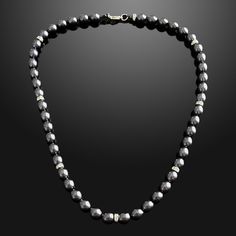 In a world saturated with mediocrity, nothing can rival the authenticity of traditional luxury. This subtly opulent necklace showcases genuine black freshwater pearls, elegantly interspersed with lab diamond silver rondelles. Hand-strung with care in our Orlando studio, this gorgeous necklace is secured with a gold bonded lobster clasp. Our Men's Pearls Collection, features sophisticated fresh water pearl necklaces and bracelets, designed especially for men. Drawing inspiration from historical r Luxury Black Pearl Chain Necklace, Elegant Black Beaded Pearl Necklace, Classic Tahitian Pearl Round Bead Necklaces, Classic Tahitian Pearl Round Bead Necklace, Formal Black Tahitian Pearl Necklaces, Classic Tahitian Pearl Beaded Necklace, Luxury Black Tahitian Pearl Necklaces, Luxury Black Pearl Necklace With Round Beads, Elegant Silver Pearl Necklace With Black Beads