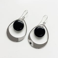 "Elegant large dangle earrings with a flat black obsidian stone, available in gold and silver finish. These elegant earrings are around 65mm long (2.5\") and finished with a gold or silver plated ear wire. Please note the display bust is not full size so the earrings look slightly bigger than they would in real life Free shipping These earrings come with a branded gift bag" Modern Teardrop Pendant Jewelry With Ear Wire, Modern Metal Teardrop Earrings, Sleek Metal Drop Earrings, Elegant Black Enamel Hoop Earrings, Modern Teardrop Chandelier Earrings, Elegant Black Long Drop Chandelier Earrings, Elegant Black Enamel Metal Earrings, Modern Onyx Earrings With Black Enamel, Modern Black Enamel Drop Earrings