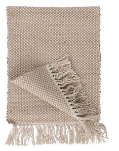 a beige and white blanket with fringes on it