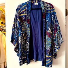 Nwot Zara Trafaluc Floral Kimono Style Robe Jacket Beach Coverup Boho Sweater Fun Kimono Style Robe To Wear As A Beach Coverup Or With A Cami And Jeans For A Night Out. Never Worn That I Remembersigh! Size M Outer Shell Is A Gorgeous Navy Floral. Inside Is Lined A A Navy Blend So This Piece Has Substance And Structure. Excellent Condition! Got Questions? Send A Message. Thanks For Visiting My Closet. Blue Floral Print Outerwear For Vacation, Blue Floral Print Summer Outerwear, Summer Blue Floral Print Outerwear, Blue Floral Print Kimono For Fall, Blue Outerwear With Kimono Sleeves For Spring, Purple Long Sleeve Summer Outerwear, Long Sleeve Purple Summer Outerwear, Blue Floral Print Long Sleeve Kimono, Blue Long Sleeve Kimono With Floral Print