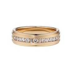 a gold wedding band with channeled diamonds