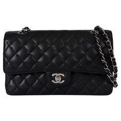 This 100% authentic Chanel Classic Medium 11.12 double flap shoulder bag is crafted from black quilted caviar leather with silver-tone hardware. It features an exterior open pocket on the back and a classic double chain strap with leather interweaving. The bag opens with the iconic CC twist lock followed by a second flap with a snap button closure. The exterior flap features a discreet zip pocket, traditionally known for storing love letters. The interior is lined with black leather and features a lipstick pocket and two open pockets on the back, offering both elegance and functionality. Has been carried and shows faint scratches on the inner flap and the lining. Overall in excellent condition. Measurements Model REV A01112 Y01864 C3906 Height 15cm (5.9in) Width 25.5cm (9.9in) Depth 6.5cm Classic Bags With Palladium Hardware And Double Flap, Classic Double Flap Business Bag, Classic Bag With Palladium Hardware And Double Flap, Classic Shoulder Bag With Double Flap And Palladium Hardware, Business Bags With Silver-tone Hardware And Double Flap, Classic Textured Leather Flap Bag, Classic Bags With Double Flap And Silver-tone Hardware, Formal Quilted Double Flap Bag, Classic Shoulder Bag With Silver-tone Hardware And Double Flap