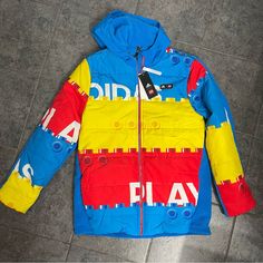 Nwt Adidas Jackets & Coats Adidas Lego Kids Jacket Us Xl Pit To Pit: 22” Length: 29.5” This Is The Coolest Coat For A Lego Lover! Playful Winter Outerwear For Outdoor Activities, Playful Winter Outerwear For Outdoor, Casual Multicolor Puffer Jacket For Outdoor, Playful Hooded Outerwear For Outdoor Activities, Playful Long Sleeve Streetwear Outerwear, Casual Multicolor Winter Puffer Jacket, Urban Blue Long Sleeve Puffer Jacket, Blue Long Sleeve Urban Puffer Jacket, Playful Hooded Windbreaker For Winter