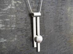 Rosario set a genuine pearl in an edgy vertical setting that fits right in with our Pendulum collection. Delivered on an 18' sterling silver chain. $49 4 grams. Silver Jewelry Handmade, Metal Work, Silver Pearls, Silver Jewellery, Sterling Silver Chain, Pearl Pendant, Sterling Silver Chains, Silver Fashion, Silver Chain