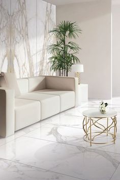 a modern living room with marble floors and walls, white couches and a plant in the corner