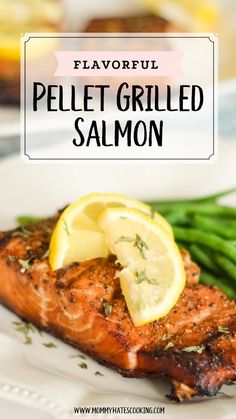 a plate with salmon, asparagus and lemon on it that says flavorful pellet grilled salmon