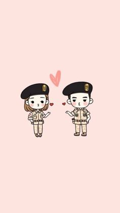 two people in uniforms are standing next to each other and one is holding a heart