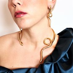 Model : Twisted Single Loose snake necklace Collection: Ofis Metal of Construction: BRASS (or Silver or Gold - upon your instructions) Effect: Gold-plated with lustrous effect Handcrafted in Greece Slightly adjustable size - open for your convenience ++ 2 pcs GOLD-PLATED with Lustrous effect available for immediate dispatch++ The design can also be constructed in gold 14K or 18K (either platinum) ONLY upon request... Price will be advised.- For any questions/inquiries please do not hesitate to a Unique Metal Jewelry With Snake Shape, Elegant Adjustable Snake Shape Necklaces, Elegant Adjustable Snake Shape Necklace, Unique Snake-shaped Metal Jewelry, Gold Snake Shape Jewelry For Parties, Metal Snake Shape Necklace As Gift, Metal Snake-shaped Necklace For Gift, Snake-shaped Metal Necklace For Gift, Gold-tone Snake Chain Necklace For Parties