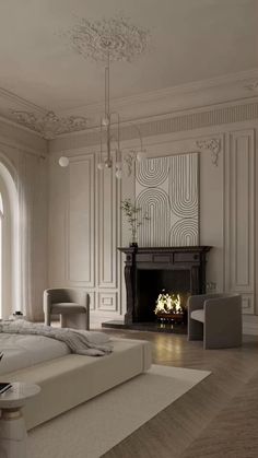 a large bedroom with a fireplace in the center and white walls, along with an arched window