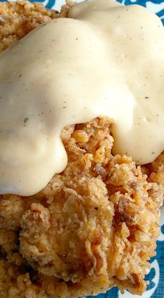 a close up of food on a plate with gravy