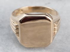 This vintage signet ring is handsome and classic! The shoulders of the ring have a grooved design that catches the light beautifully. The top is smooth and polished, ready to be engraved with the monogram of your choice. Market Square Jewelers works with one of the finest hand engravers in the northeast. With over 30 years of experience, our engraver hand carves lettering, monograms, crests, or patterns in period-specific styles. Choose from our many monogram options shown in the listing or contact us directly with your own crest, monogram or for additional information, and pricing! Metal: 10K Yellow Gold Top Measurements: 14 x 16 mm, Rectangle Ring Size: 8.75 Marks: "10K" Stamped on the inside band Crest Monogram, Rectangle Ring, Diamond Signet Ring, Signet Ring Men, Vintage Rose Gold, Market Square, Gold Signet Ring, Gold Top, Vintage Roses